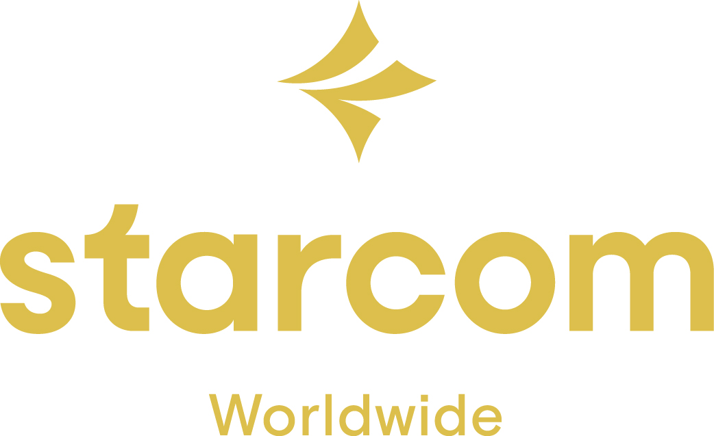 Starcom Worldwide -logo ja -liikemerkki valkoisella taustalla